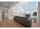 An open-concept living room featuring a fireplace and large windows that fill the space with natural light at 22935 E River Chase Way, Parker, CO 80138