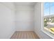 Walk-in closet with carpet, white shelving and natural light from a window at 22935 E River Chase Way, Parker, CO 80138