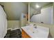 Bright bathroom with a shower, toilet, and vanity with updated fixture at 7510 Blue Creek Rd, Evergreen, CO 80439