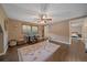 Bright bedroom with desk and chair, ceiling fan, and stylish area rug at 7510 Blue Creek Rd, Evergreen, CO 80439