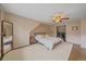 Cozy bedroom with a spacious walk-in closet and comfortable bed at 7510 Blue Creek Rd, Evergreen, CO 80439