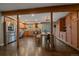 Spacious kitchen featuring stainless steel appliances, wooden cabinets, and dining table with outdoor views at 7510 Blue Creek Rd, Evergreen, CO 80439