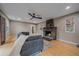Cozy living room with a striking stone fireplace and a comfortable gray couch at 7510 Blue Creek Rd, Evergreen, CO 80439