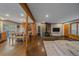 Spacious open-concept living area with a fireplace and wood flooring at 7510 Blue Creek Rd, Evergreen, CO 80439