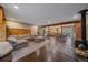 Expansive living area with a fireplace and modern furnishings. Open layout to kitchen at 7510 Blue Creek Rd, Evergreen, CO 80439