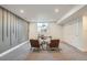 Finished basement space with a decorative wall, modern lighting, and flexible space for a home office at 7452 W Cedar Cir, Lakewood, CO 80226