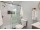 Updated bathroom featuring marble tiled shower with glass door and modern finishes at 7452 W Cedar Cir, Lakewood, CO 80226