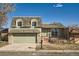 Charming two-story home showcasing a well-maintained lawn and a welcoming entrance at 7452 W Cedar Cir, Lakewood, CO 80226