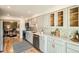 Modern kitchen featuring stainless steel appliances, light colored cabinets, and ample storage at 7452 W Cedar Cir, Lakewood, CO 80226