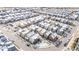 Aerial view showcasing colorful homes with snow-covered roofs in a well-planned neighborhood during winter at 6764 Osage St, Denver, CO 80221