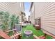 The backyard has a stone firepit and artificial grass at 6764 Osage St, Denver, CO 80221