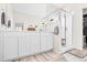 Bright bathroom featuring double vanity, framed mirror, and glass enclosed shower at 6764 Osage St, Denver, CO 80221