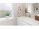 Stylish bathroom featuring a sleek countertop, mirror, and modern fixtures at 6764 Osage St, Denver, CO 80221