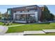 Exterior view of the Brewery with outdoor seating, lush landscaping, and inviting atmosphere at 6764 Osage St, Denver, CO 80221