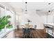 Bright dining area with sliding glass doors and a modern round table at 6764 Osage St, Denver, CO 80221