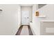 Welcoming entryway with hardwood floors, storage, and modern decor at 6764 Osage St, Denver, CO 80221