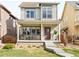 Charming two-story home with inviting front porch and well-maintained landscaping at 6764 Osage St, Denver, CO 80221