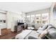 Living room with a comfortable seating area, hardwood floors, and lots of natural light at 6764 Osage St, Denver, CO 80221