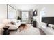 Cozy living room with large windows and a comfortable couch at 6764 Osage St, Denver, CO 80221