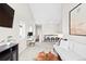 Spacious living area with a large sectional sofa, desk, and snack bar at 6764 Osage St, Denver, CO 80221