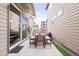 The backyard patio includes outdoor seating and a sliding glass door into the home at 6764 Osage St, Denver, CO 80221