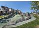 Community playground featuring unique rock formations, slides, and colorful play equipment near residential homes at 6764 Osage St, Denver, CO 80221
