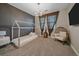 Cozy bedroom with carpet, a platform bed, and a stylish chair, creating a comfortable retreat at 14589 Hagus Pl, Parker, CO 80134