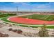 View of a sports field with a track in a stadium setting at 14589 Hagus Pl, Parker, CO 80134
