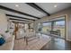 Open concept living area with hardwood floors, sliding glass doors, and comfortable seating at 14589 Hagus Pl, Parker, CO 80134
