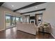 Bright living room features a fireplace, dark beams and access to the outdoor living space at 14589 Hagus Pl, Parker, CO 80134