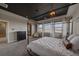 Serene main bedroom featuring a dark ceiling, neutral décor, and a comfortable king-size bed at 14589 Hagus Pl, Parker, CO 80134