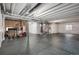 Unfinished basement with rubber flooring provides ample space for storage and customization at 16195 Red Bud Loop, Parker, CO 80134