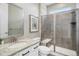 Modern bathroom with a glass-enclosed shower, granite countertop, and sleek fixtures at 16195 Red Bud Loop, Parker, CO 80134