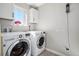 Bright laundry room featuring a modern washer and dryer and lots of natural light at 16195 Red Bud Loop, Parker, CO 80134