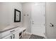 Functional mudroom with built-in bench, coat hooks, and storage cabinets for organization at 16195 Red Bud Loop, Parker, CO 80134