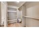 Walk-in closet with built-in shelves and ample storage space for organization at 7755 E Quincy Ave # 104A1, Denver, CO 80237