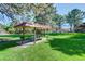 Shaded picnic and grill area in a well-maintained green space at 7755 E Quincy Ave # 104A1, Denver, CO 80237