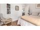Bedroom features built-in bookshelves and an open door to the living area at 1776 S Logan St, Denver, CO 80210