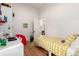 Bright bedroom featuring colorful bedding, hardwood floors, and a playful design at 1776 S Logan St, Denver, CO 80210