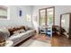 Comfortable living room with a cozy couch, large windows, and stylish decor, perfect for relaxation at 1776 S Logan St, Denver, CO 80210