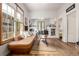 Spacious living room with large windows, hardwood floors, and a comfortable couch, creating a relaxing space at 1776 S Logan St, Denver, CO 80210