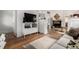 Bright living room with hardwood floors, a fireplace, and ample natural light, creating a cozy atmosphere at 1776 S Logan St, Denver, CO 80210