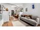 Cozy living room featuring hardwood floors, ample natural light, and a comfortable seating area at 1776 S Logan St, Denver, CO 80210
