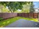 An expansive backyard is enhanced by the wood fence and garden beds at 4129 Amber St, Boulder, CO 80304