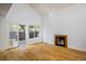 Bright living room featuring hardwood floors and a cozy fireplace at 4129 Amber St, Boulder, CO 80304