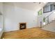 Bright living room featuring hardwood floors and a cozy fireplace at 4129 Amber St, Boulder, CO 80304