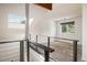 Upstairs loft area with modern railing and bright natural light at 4129 Amber St, Boulder, CO 80304