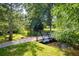 A walking path leads to a bridge over a creek in a neighborhood park at 4129 Amber St, Boulder, CO 80304