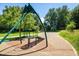 View of a playground with modern equipment set among mature trees in a well maintained community space at 4129 Amber St, Boulder, CO 80304