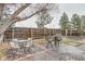 Backyard with patio furniture and a built-in fire pit, creating a welcoming outdoor living space at 6365 Xavier Ct, Arvada, CO 80003